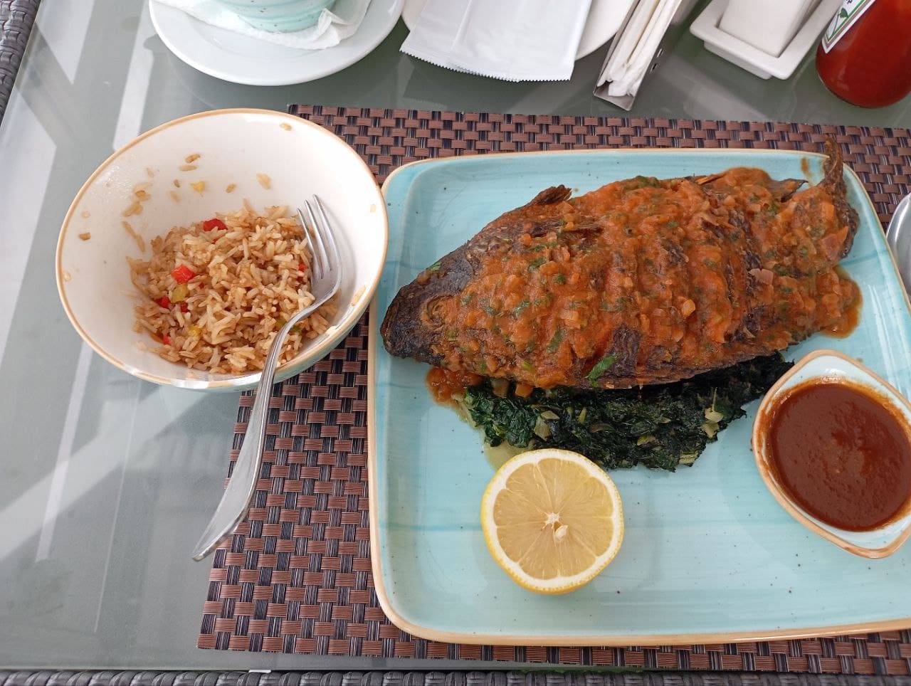 Peppered grilled tilapia with jollof rice, a NaijaBites signature dish