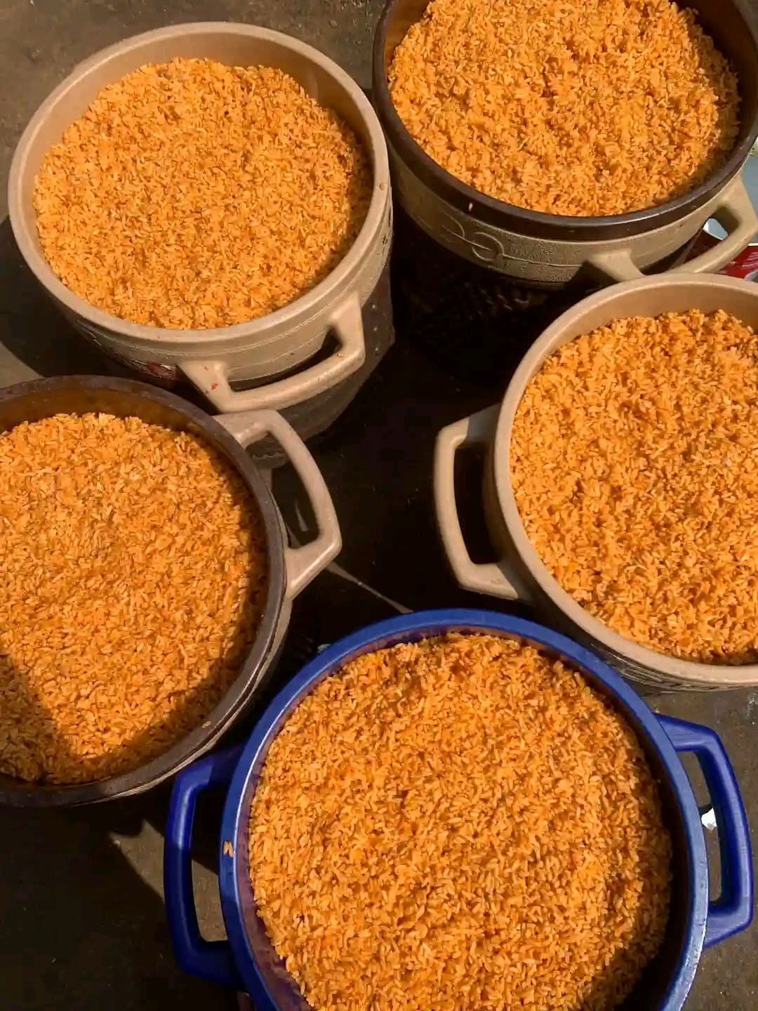 Large pots of NaijaBites party jollof rice, cooked the traditional way